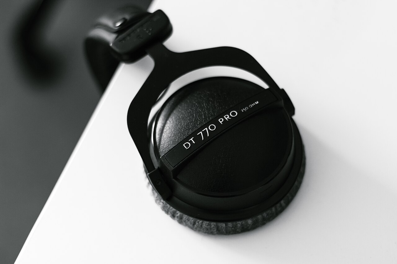 Headphones on the desk — my music setup while coding