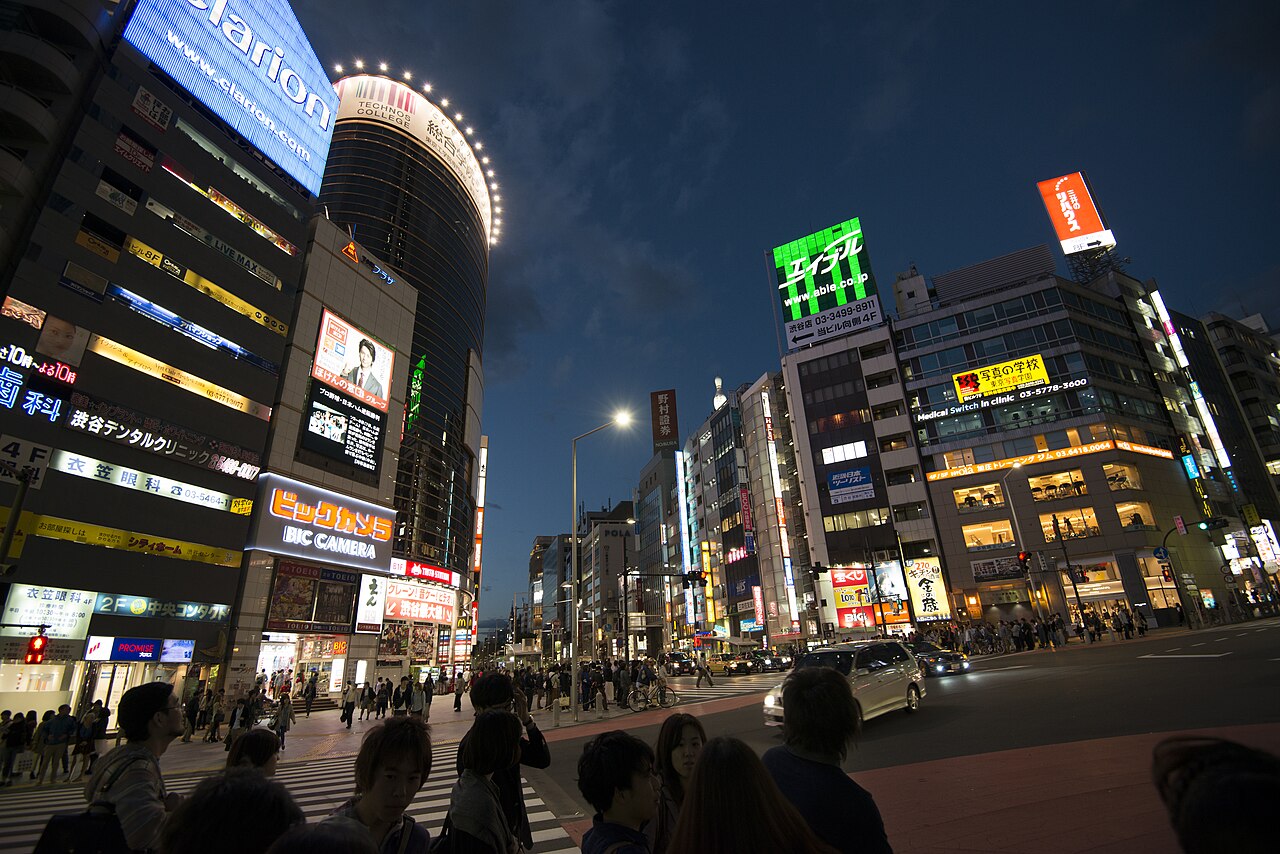 Shibuya at night — Tokyo's urban texture that gives Dandadan its mood