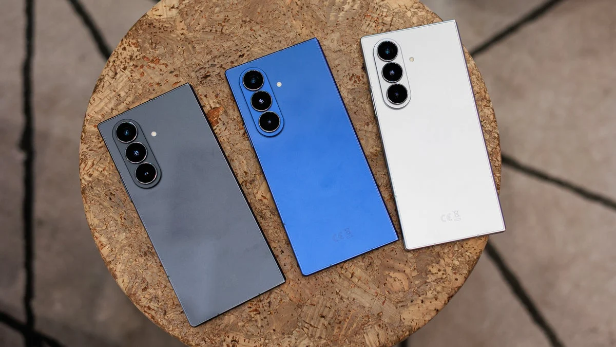 A Samsung Galaxy Z Fold 7 opened to the main screen — one half of the fold comparison